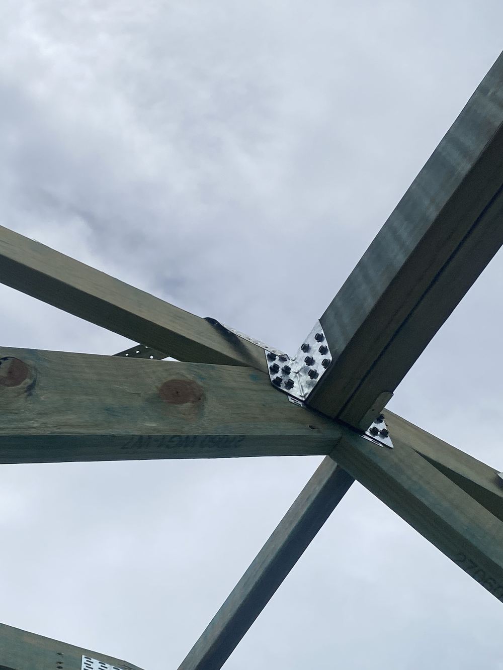 Roof brace end not bent over the truss top chord and nailed off, found during a frame inspection in Rouse Hill