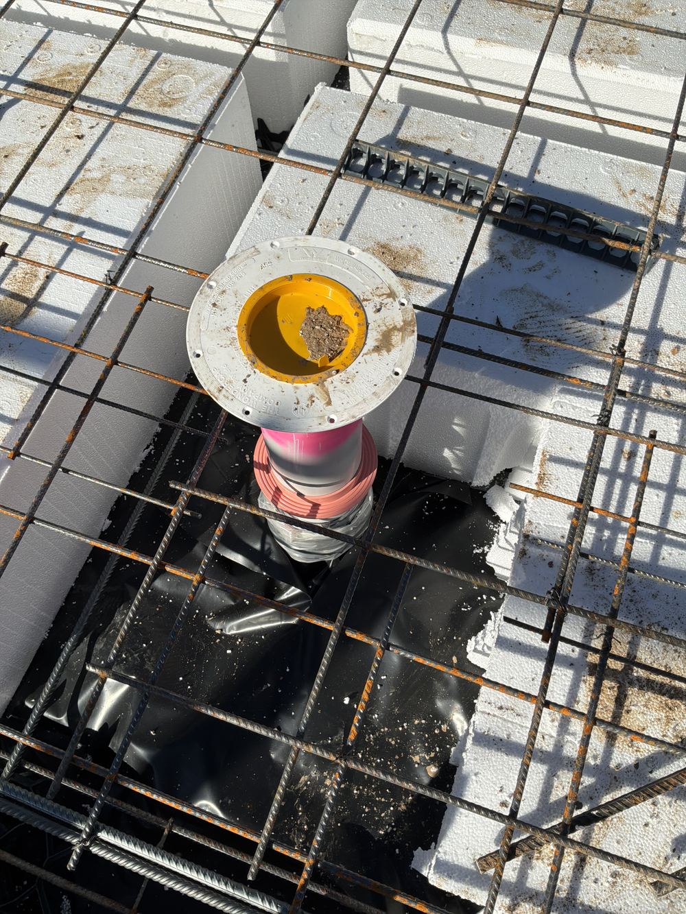 Extra bars missing where the top mesh is cut around service penetrations, Rouse Hill