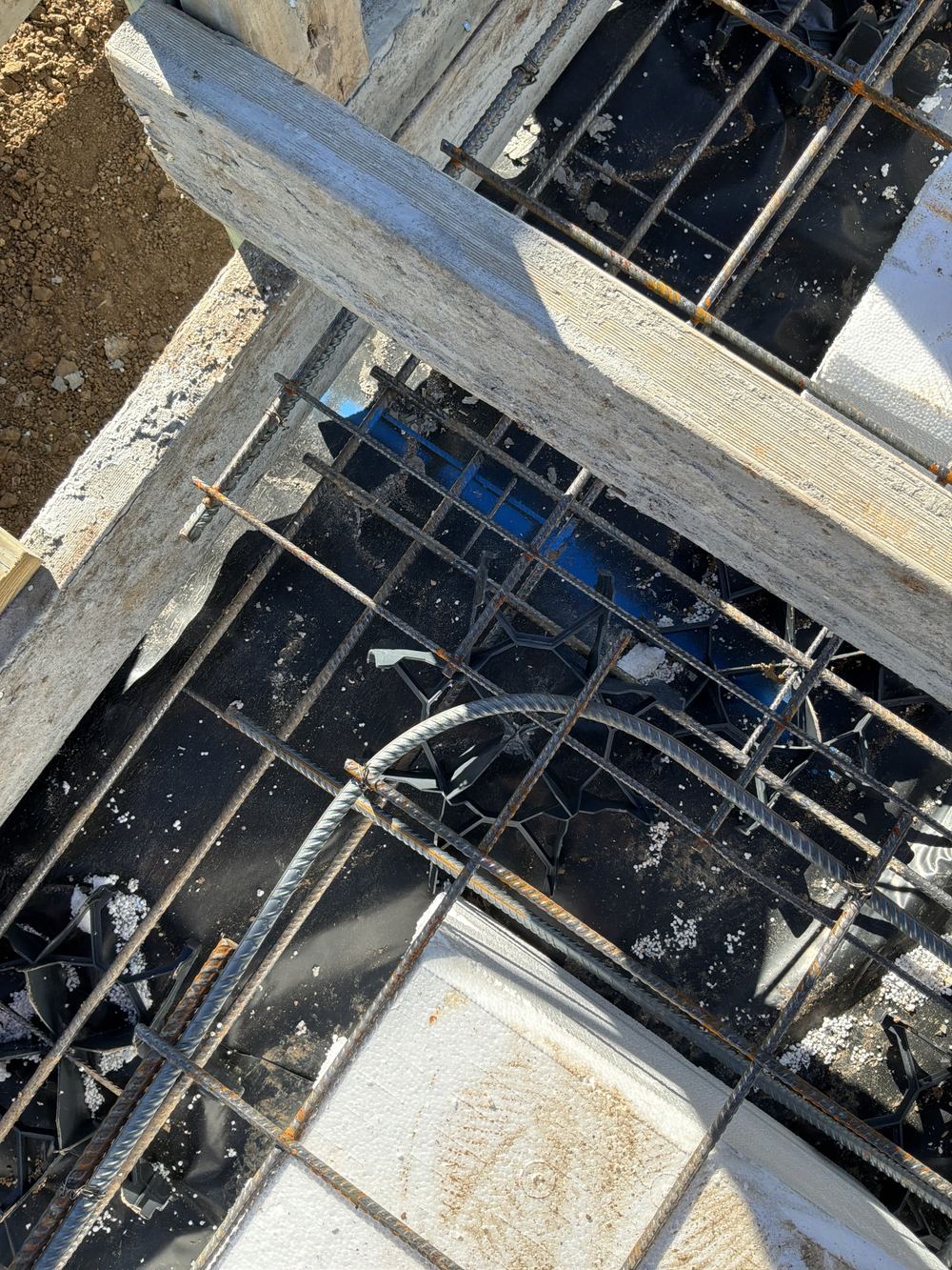 Mesh laps measured short of the minimum on a waffle slab, found during a slab pre-pour inspection in Rouse Hill