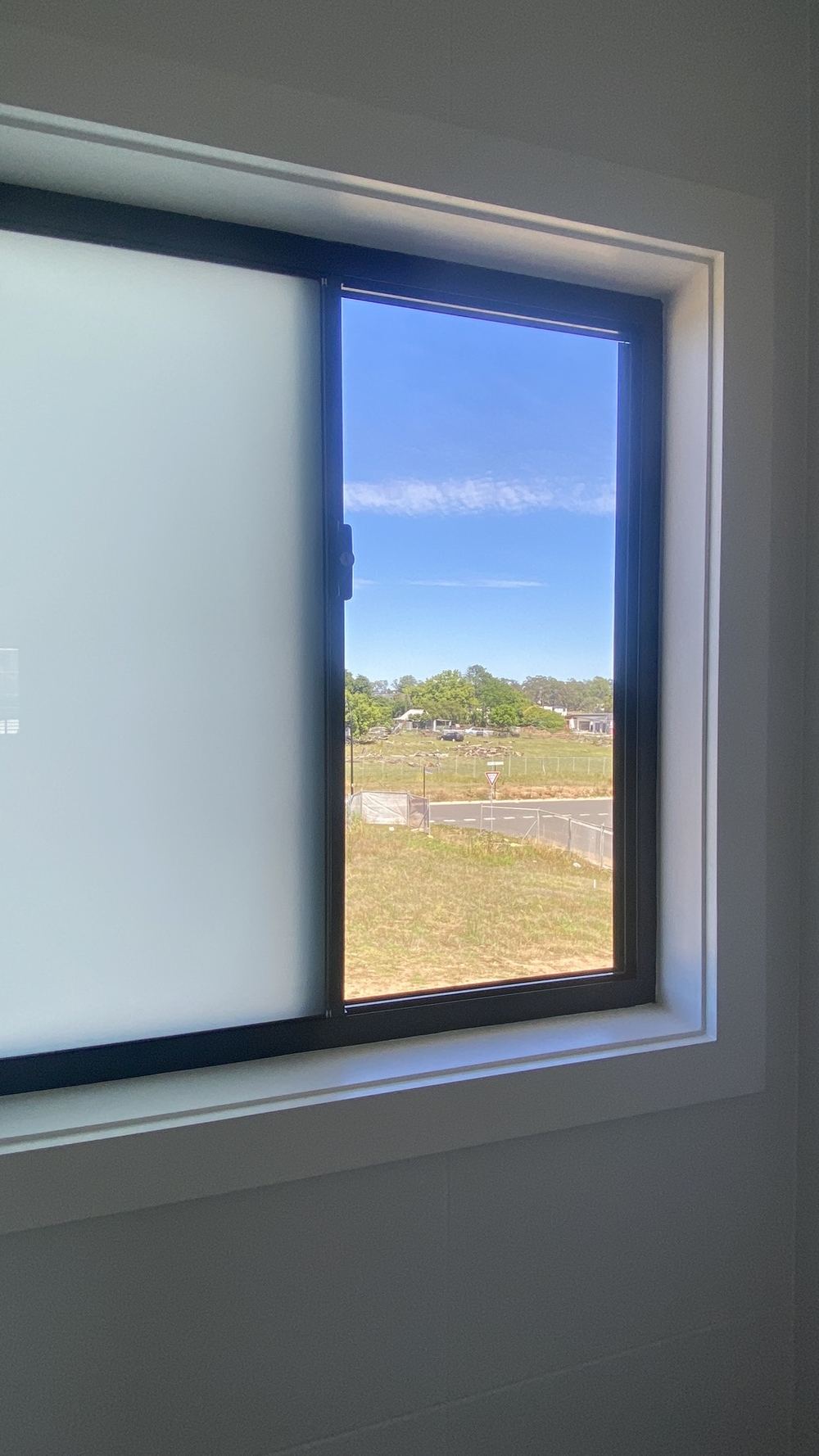 Upstairs bedroom window lacking a 125mm restrictor, found during a handover inspection in Rouse Hill